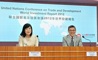 The Associate Director-General of Investment Promotion, Miss Victoria Tang, and the Dean of the Faculty of Business Administration at the Chinese University of Hong Kong, Professor T J Wong, announce the results of the "World Investment Report 2012".
